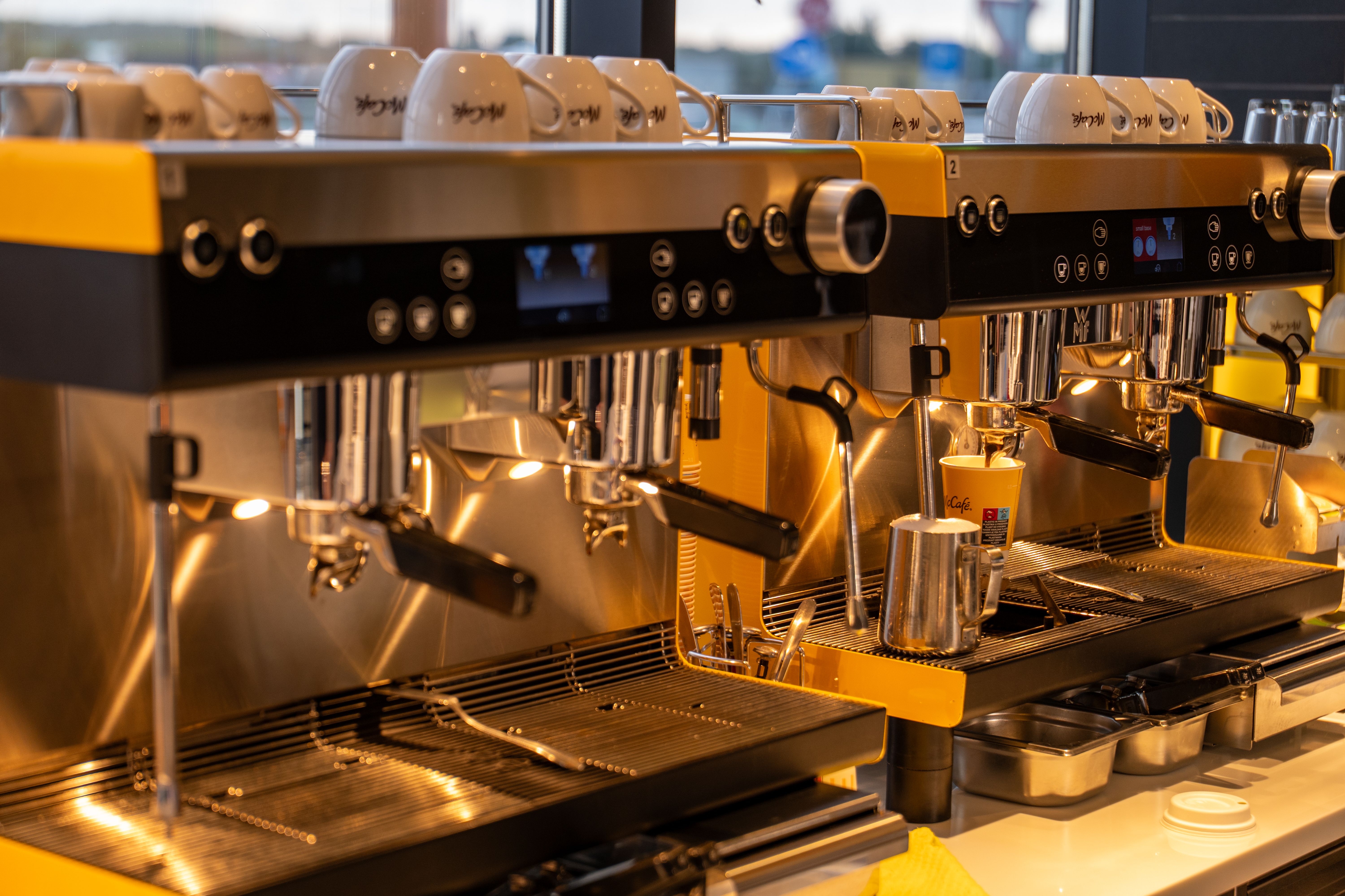 Modern Espresso Machines in a Cozy Cafe Setting · Free Stock Photo