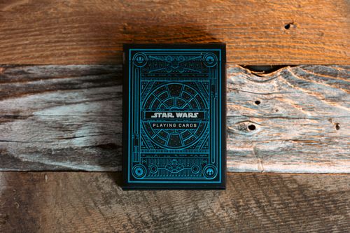 Free Blue Star Wars themed playing cards on a textured wooden surface. Stock Photo