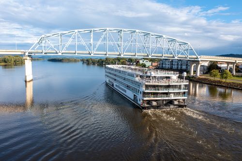 Free A riverboat cruises under a bridge on the Mississippi River in Wabasha, Minnesota, USA. Stock Photo