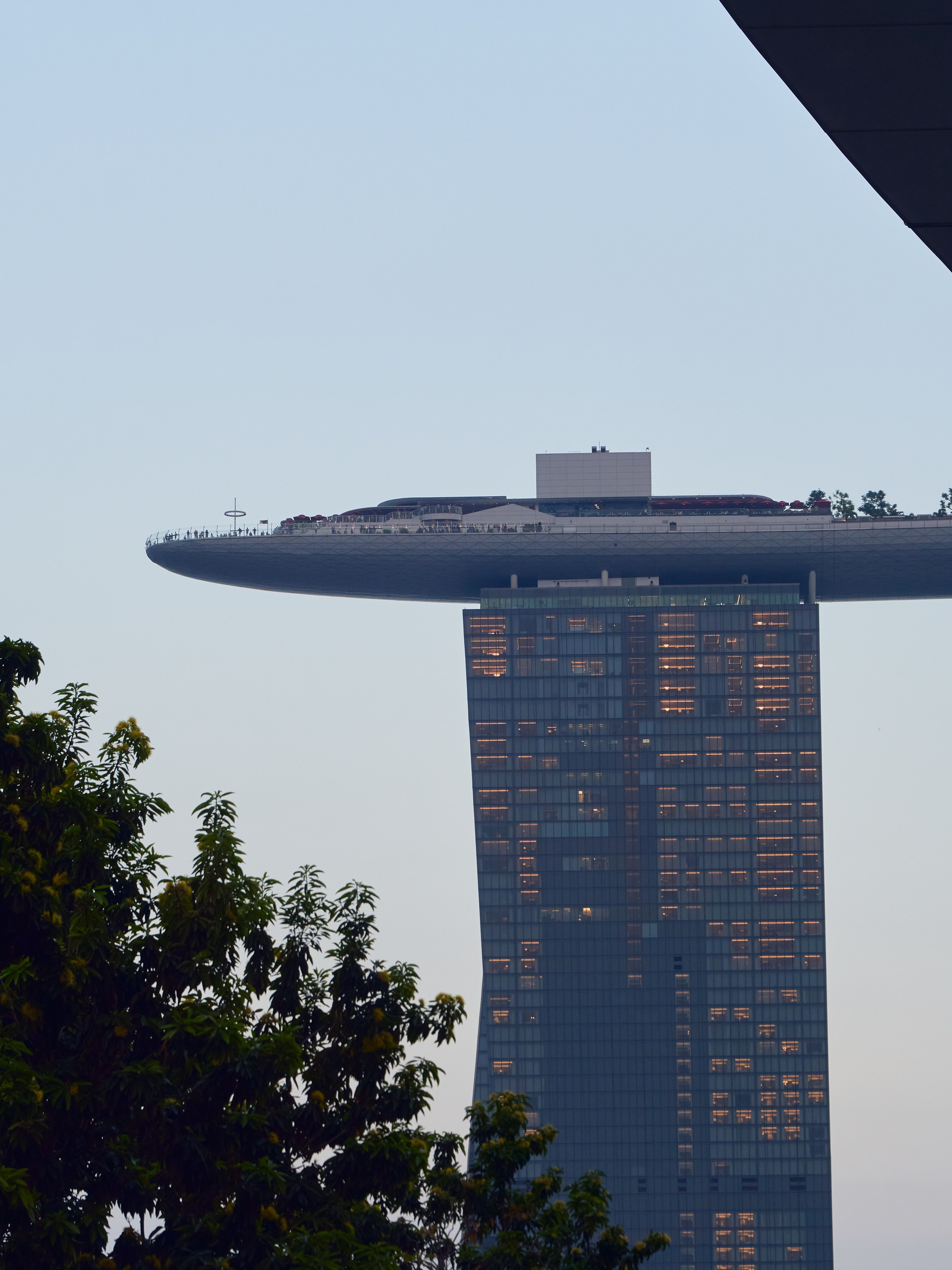 Skyline view of Marina Bay Sands with evening lights in Singapore, captured at dusk.
