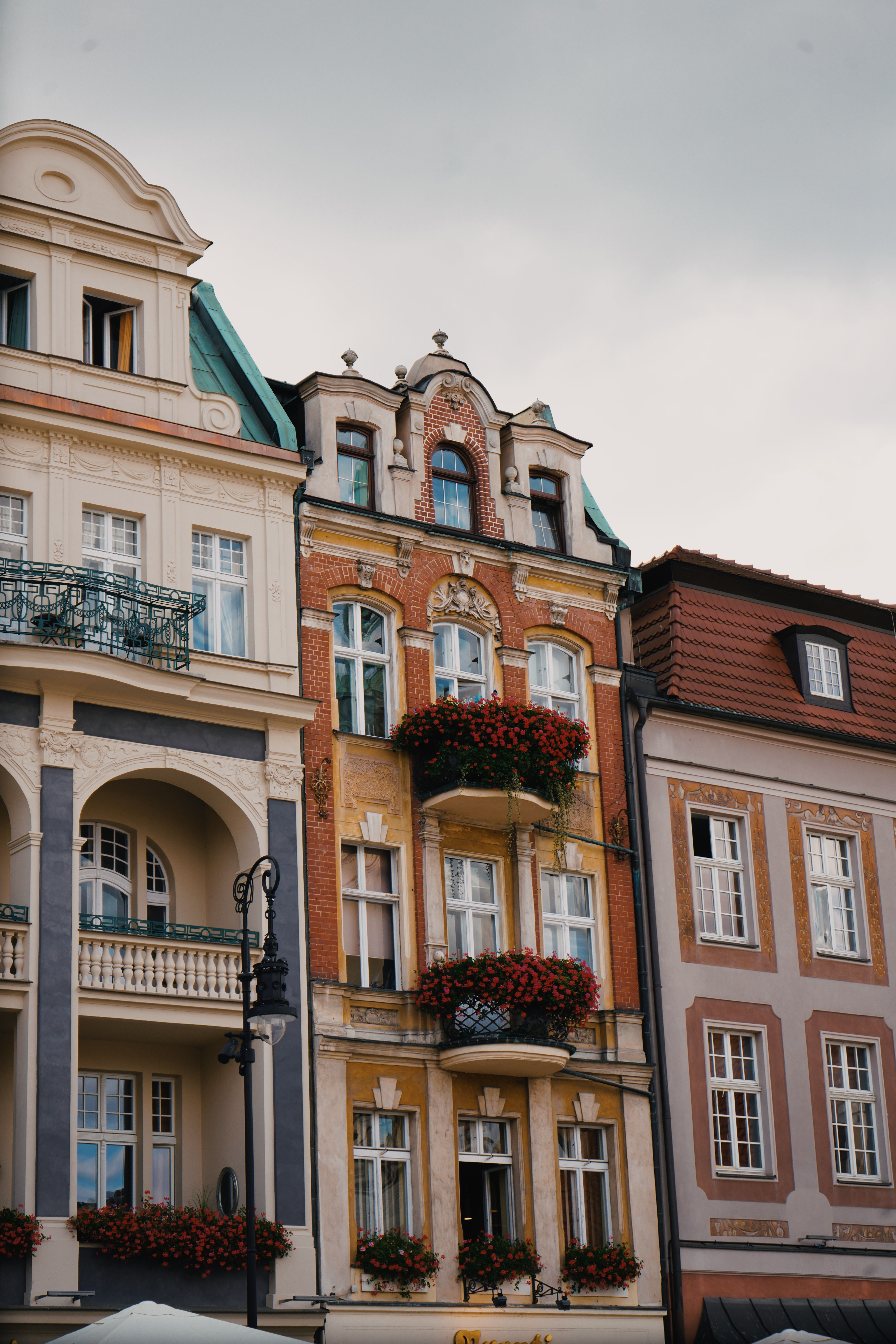 Charming European Architecture with Floral Accents · Free Stock Photo