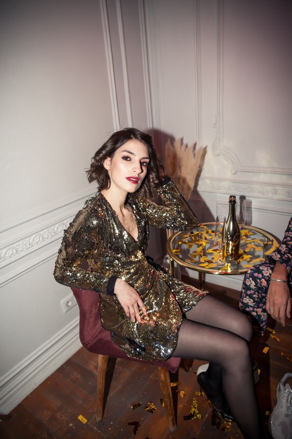 Woman in gold evening dress