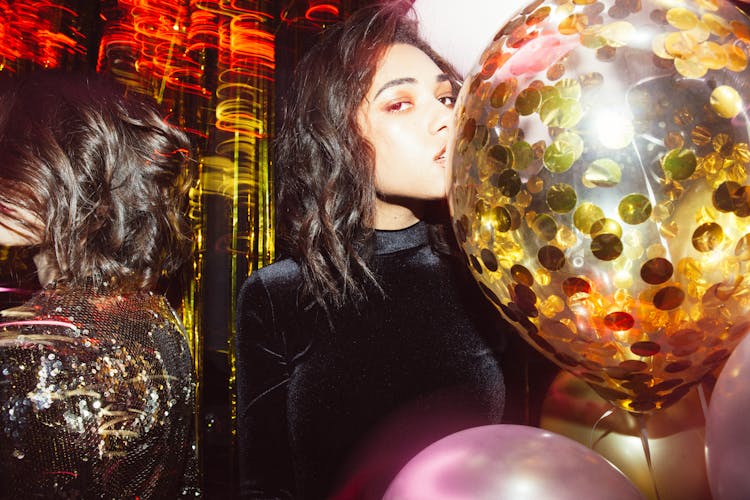 Woman Kissing Gold Balloon