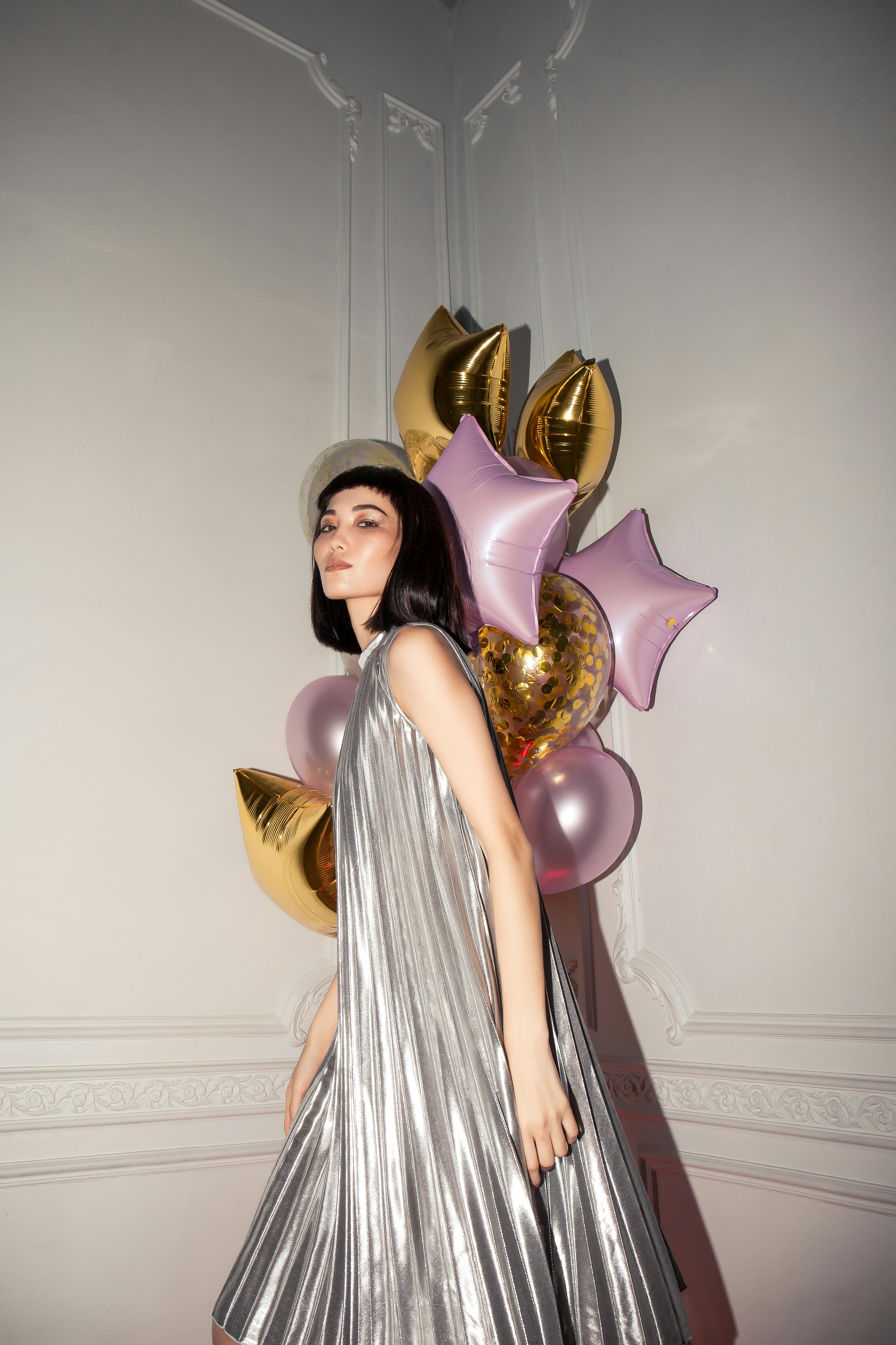 woman standing near balloons