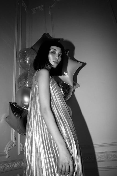 Low Angle Shot of Woman Wearing Pleated Dress