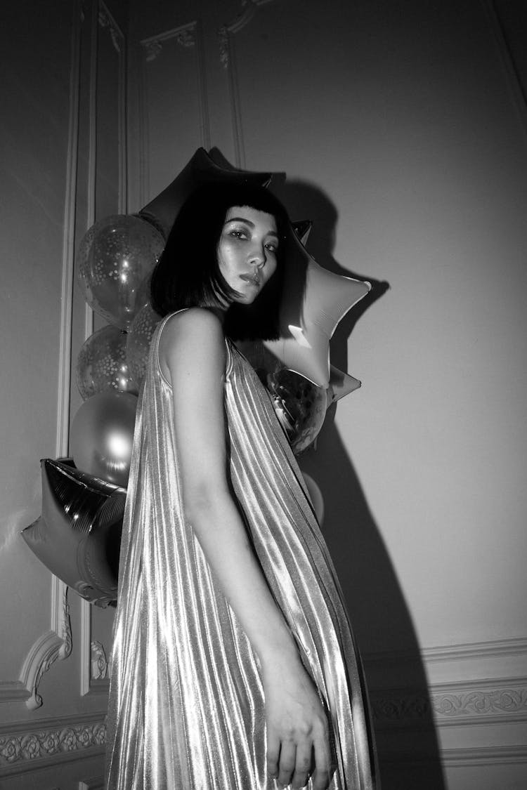 Low Angle Shot Of Woman Wearing Pleated Dress