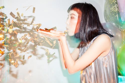 Free Woman Blowing Confetti Stock Photo