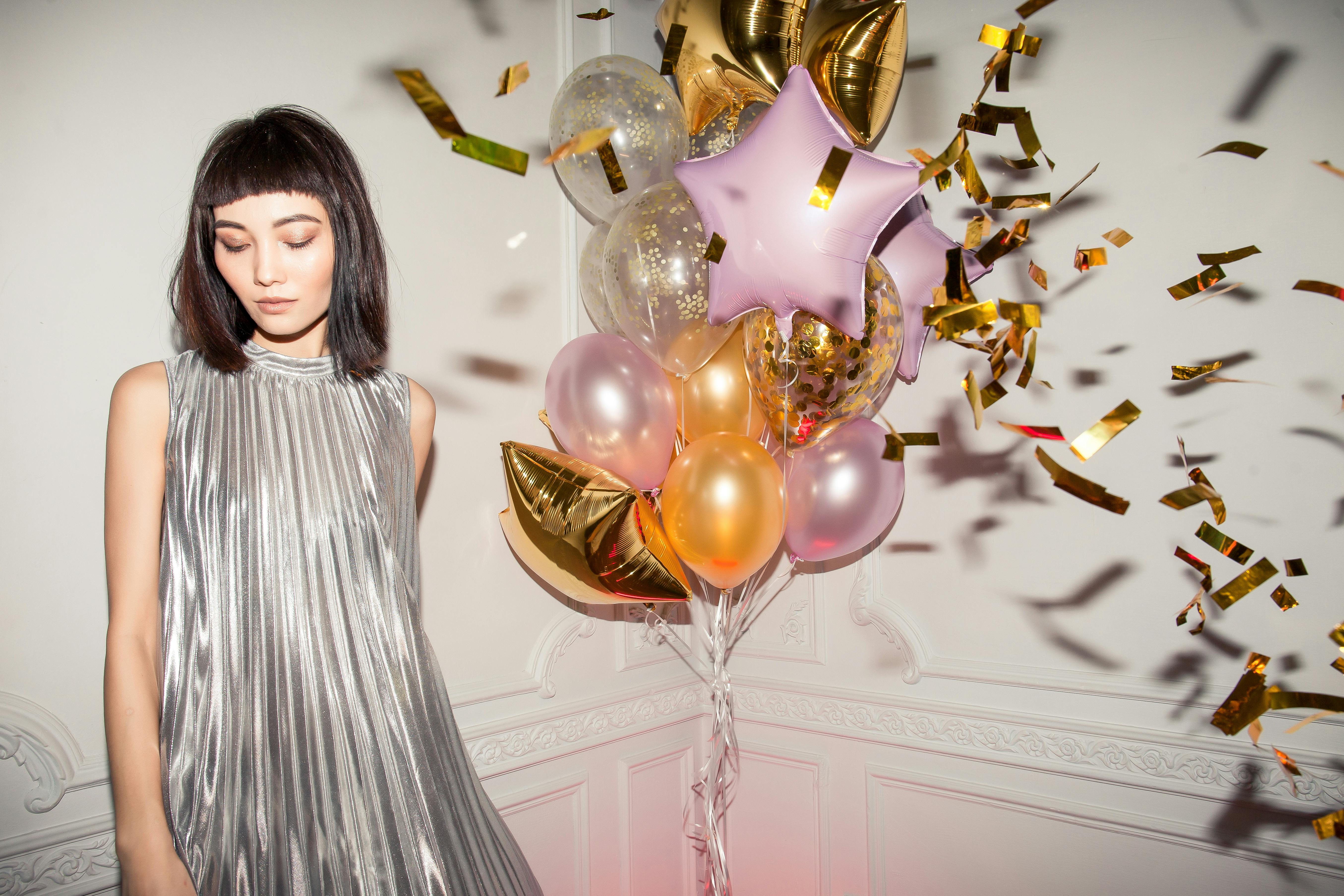 woman wearing pleated silver dress