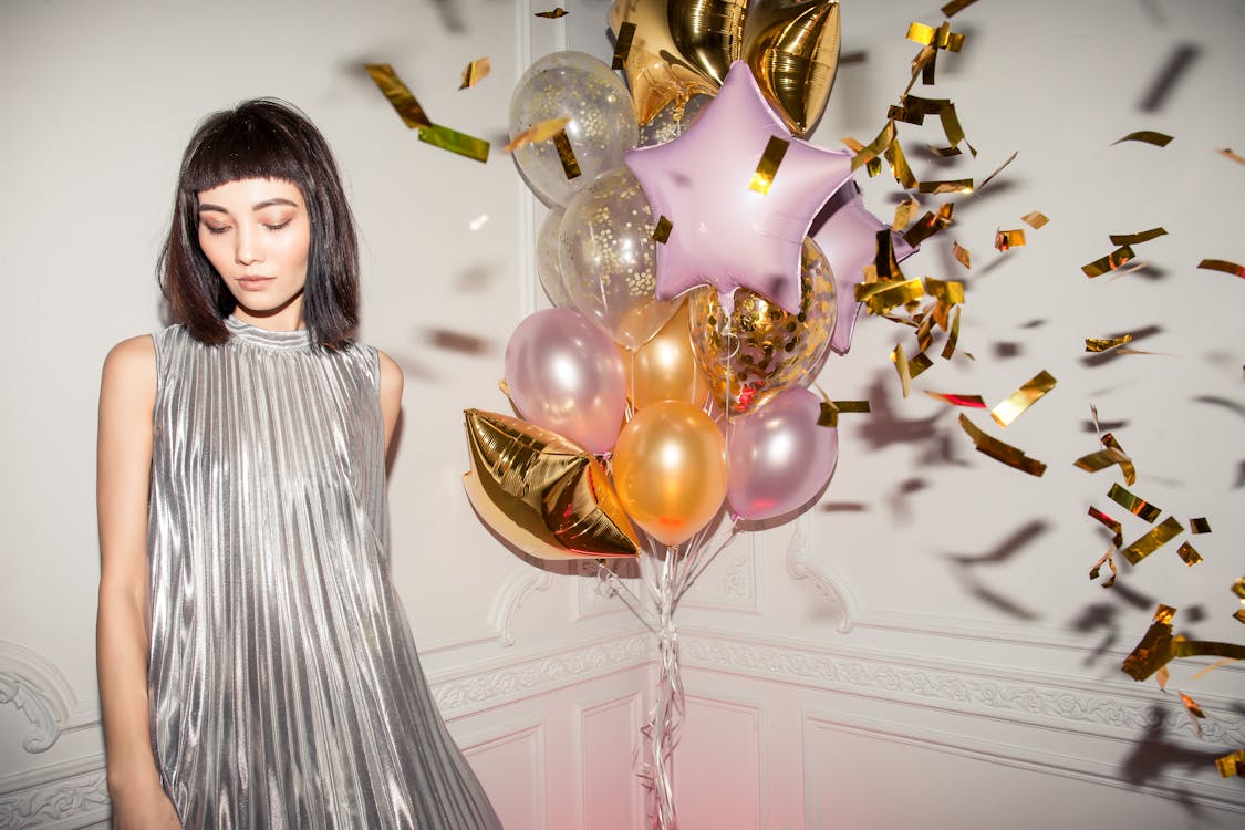 Woman Wearing Pleated Silver Dress · Free Stock Photo