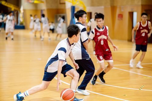 Free Dynamic action shot of a high school basketball game indoors. Stock Photo