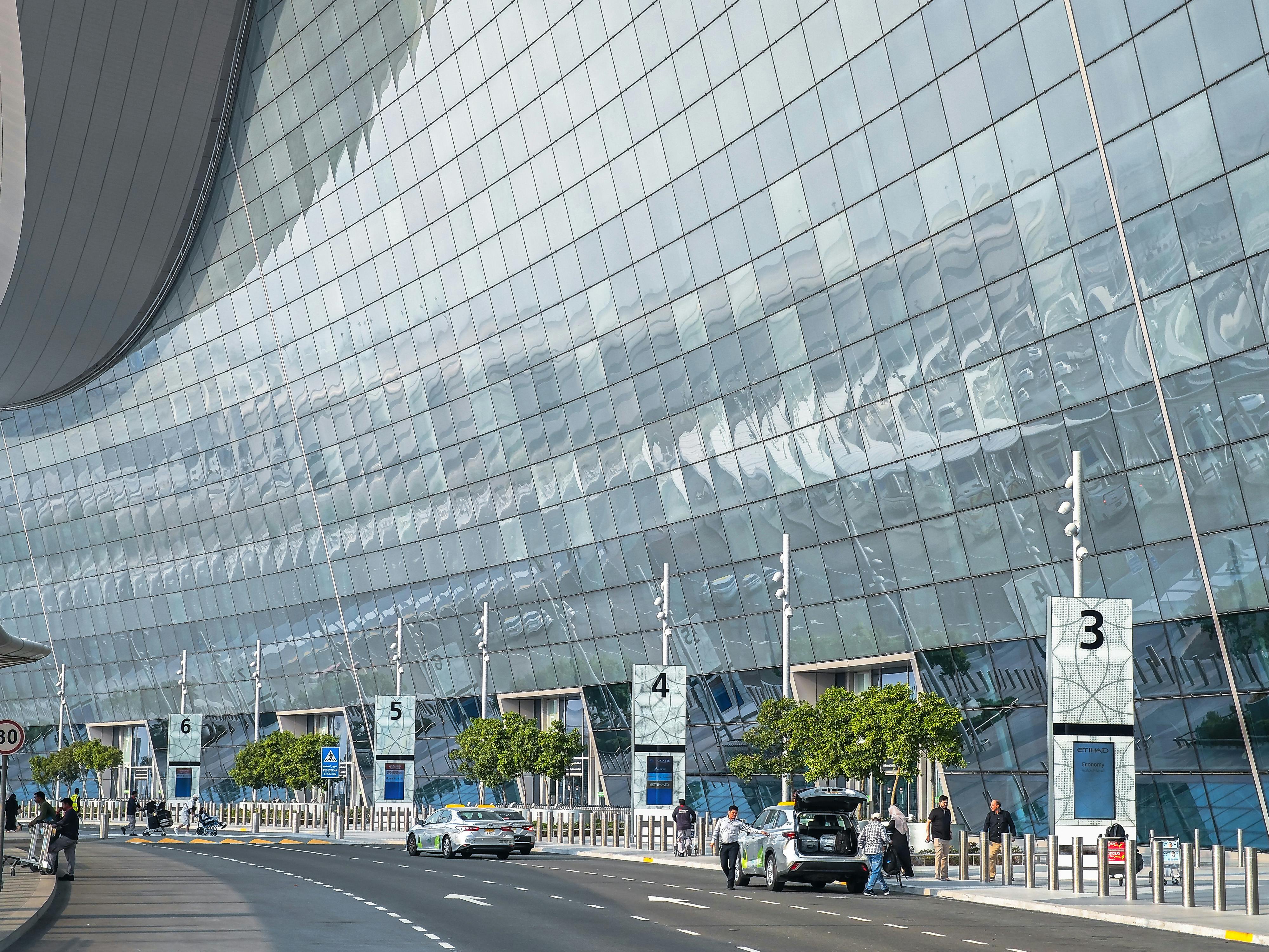 The front facade of the Abu Dhabi International Airport terminal
