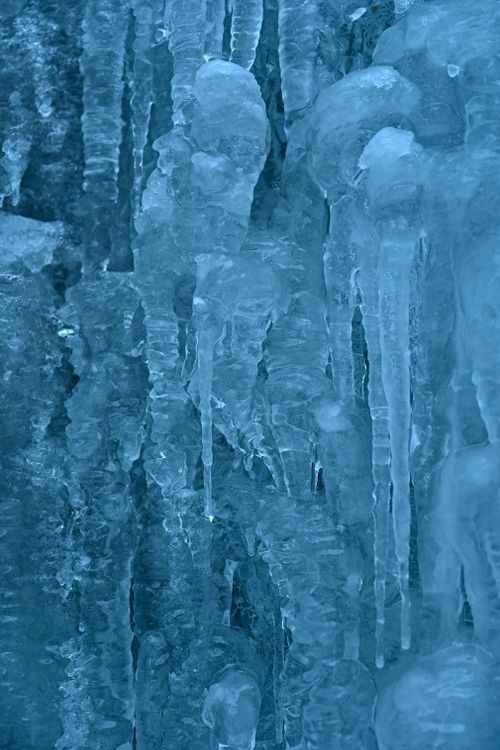 Free Detailed view of icicles with a cool blue tint, capturing the essence of winter. Stock Photo