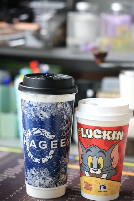 Vibrant coffee cups with Tom & Jerry design on a cafe counter.