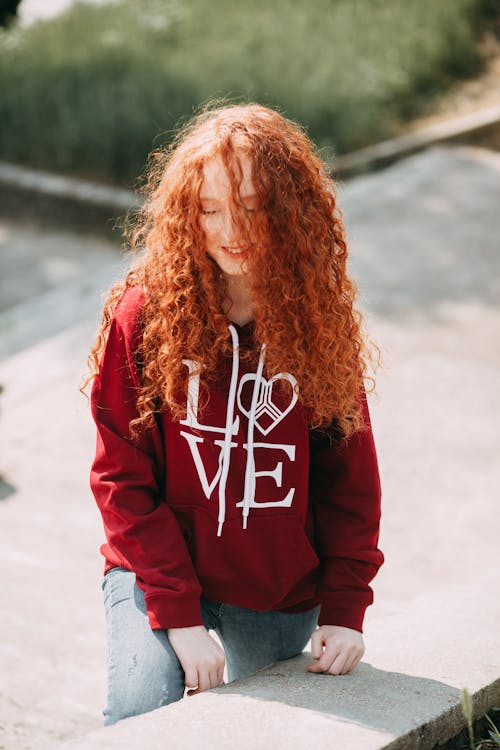 Woman Wearing A Red Hoodie