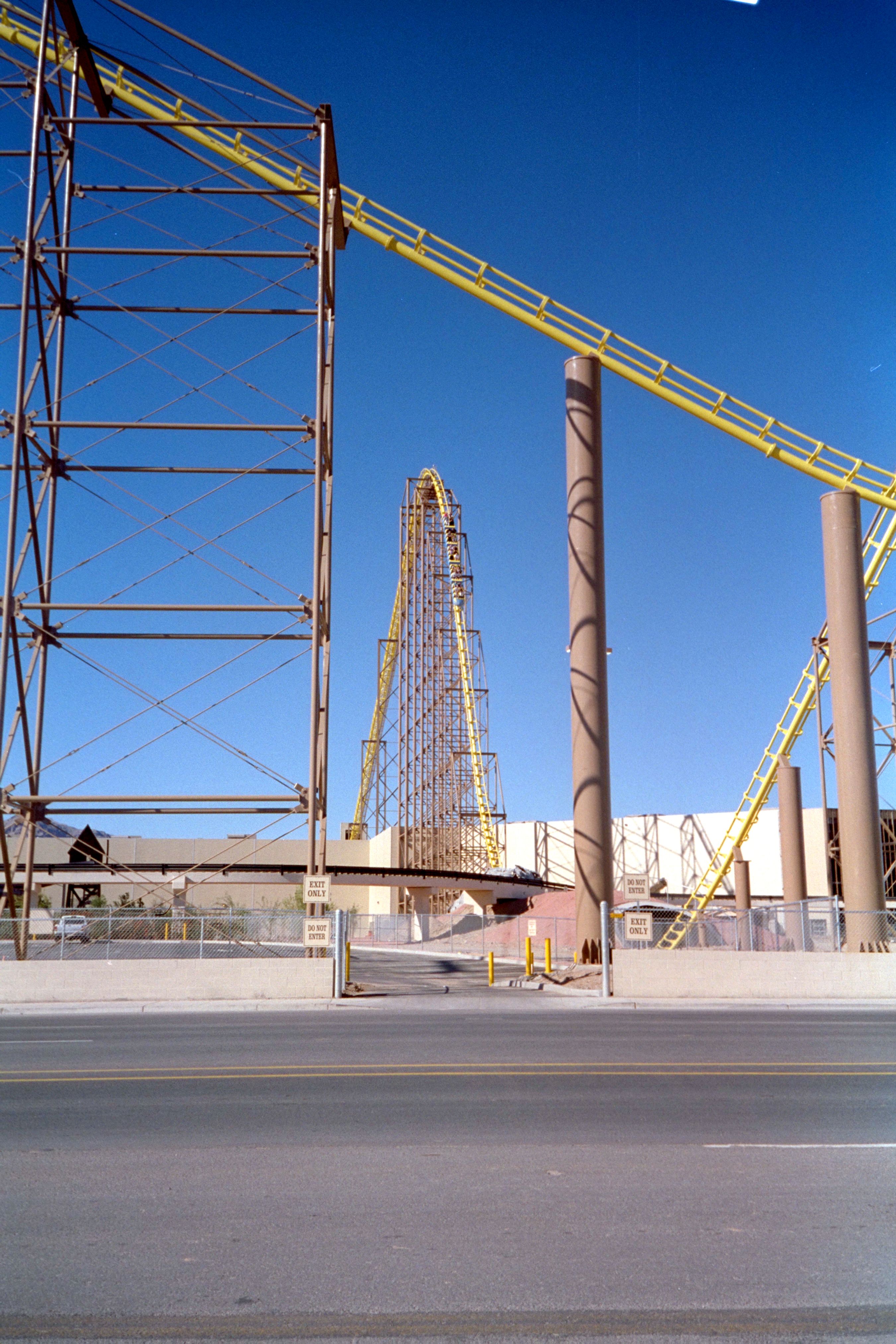 Roller coaster at Buffalo Bill's Casino in Stateline, Nevada, showcasing steel structure against blue sky.