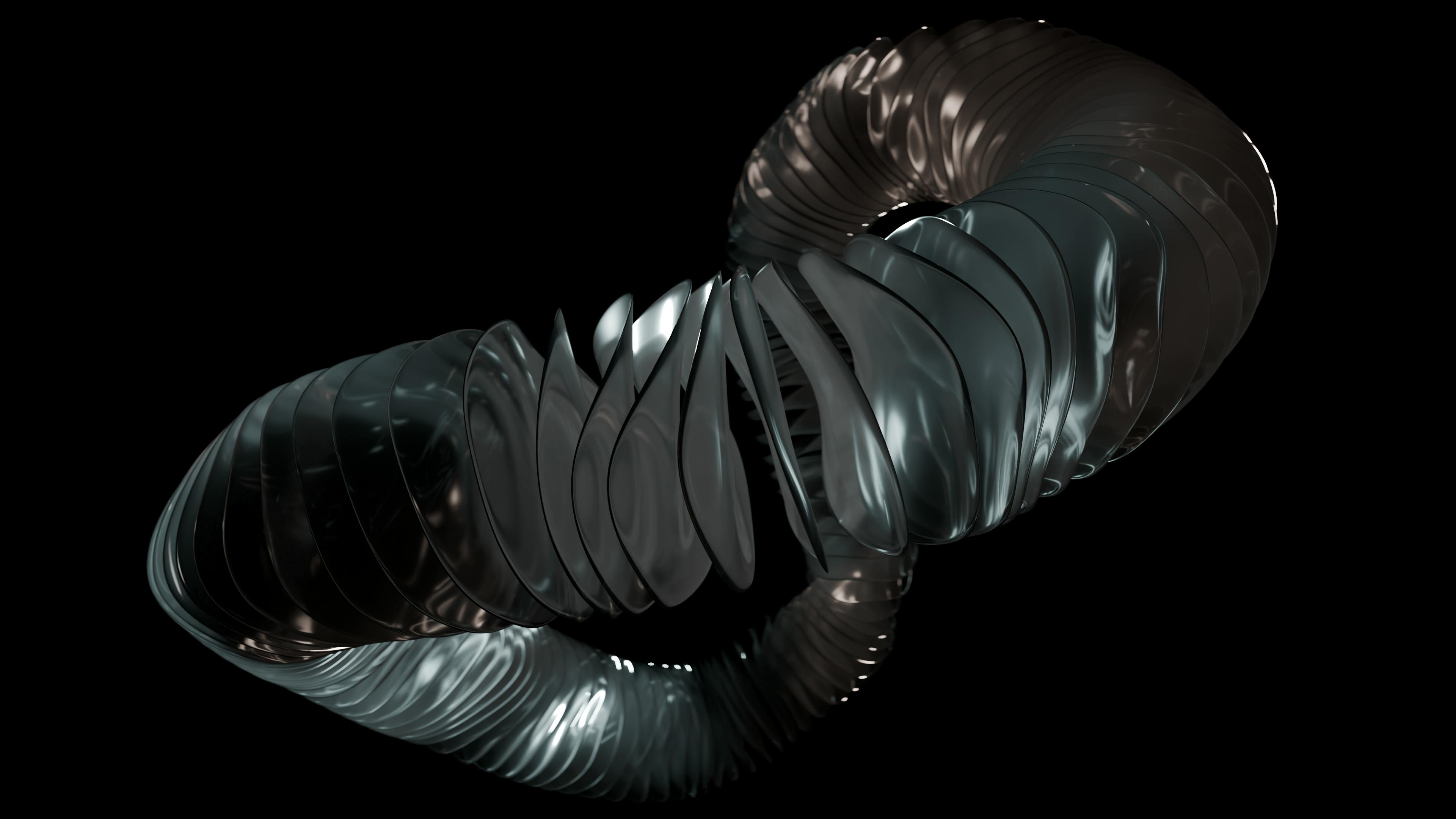 ingyenes Egy feltűnő absztrakt minta egy fekete fém spirálról fekete háttéren. Stockfotó