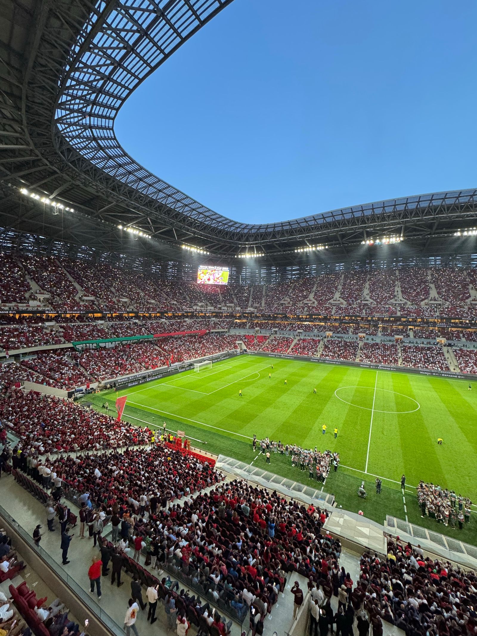 Exciting Football Match at Packed Stadium · Free Stock Photo
