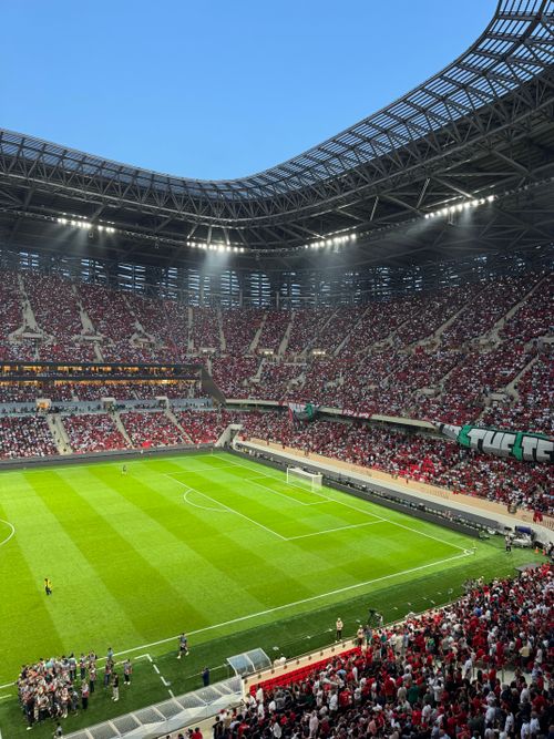 Exciting Football Match at Packed Stadium · Free Stock Photo