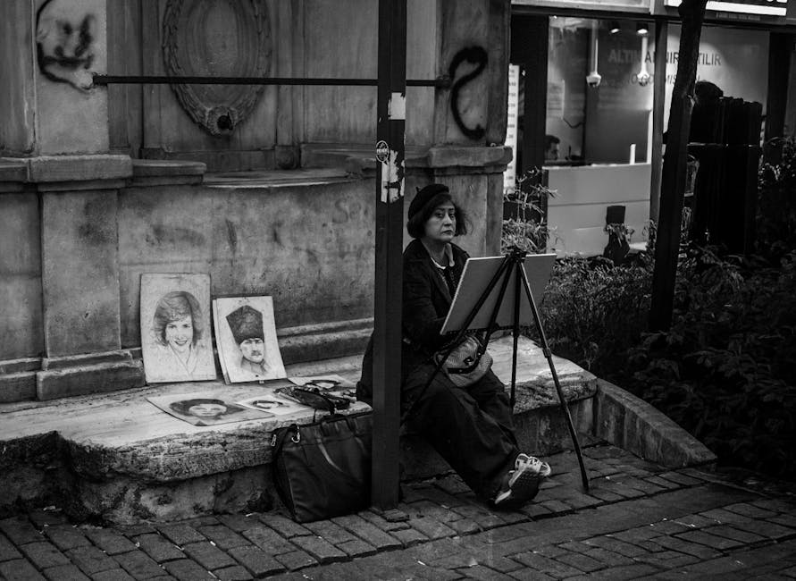 A street artist creates portraits in black and white on a bustling street in Istanbul.