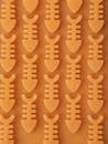 Abstract pattern of orange fishbone shapes