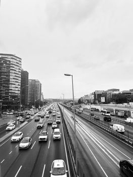 Monochrome view of a bustling highway in Istanbul with modern buildings.