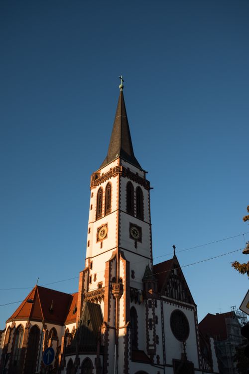 Free Gothic church with intricate designs, bathed in warm sunset light. Stock Photo