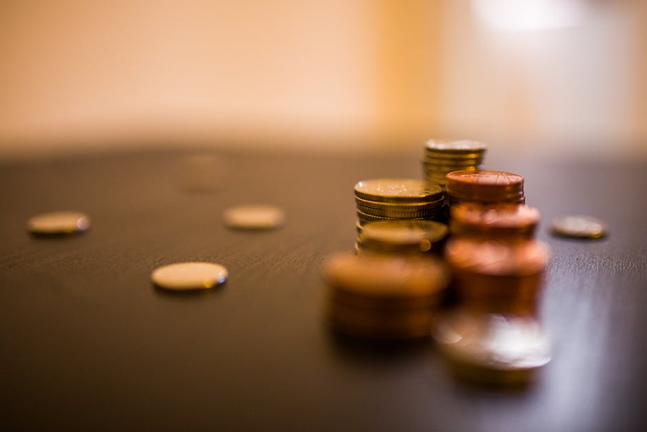 Web photo of coins stacked on a table.