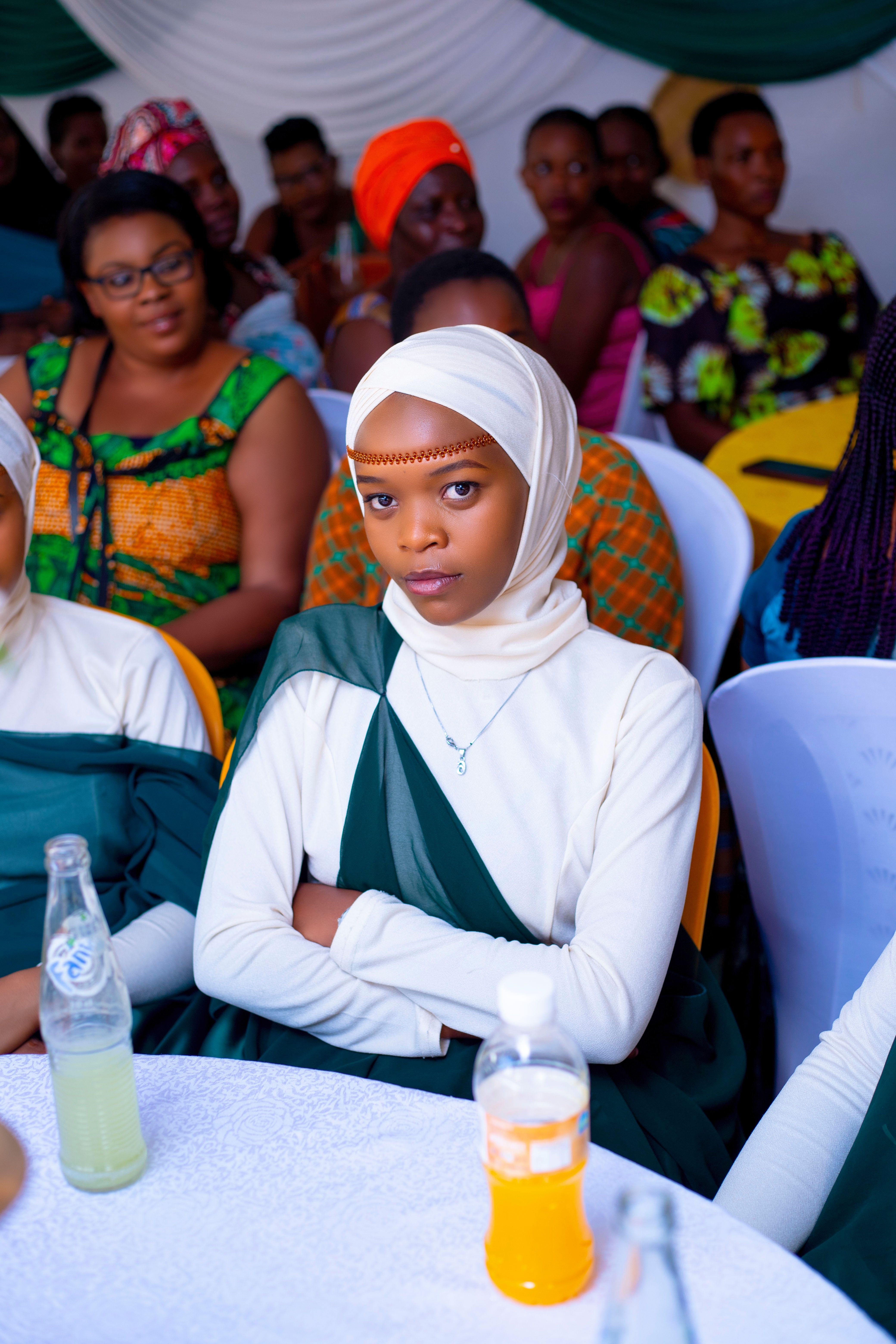 Cultural Event with Diverse Attendees Seated Indoors · Free Stock Photo