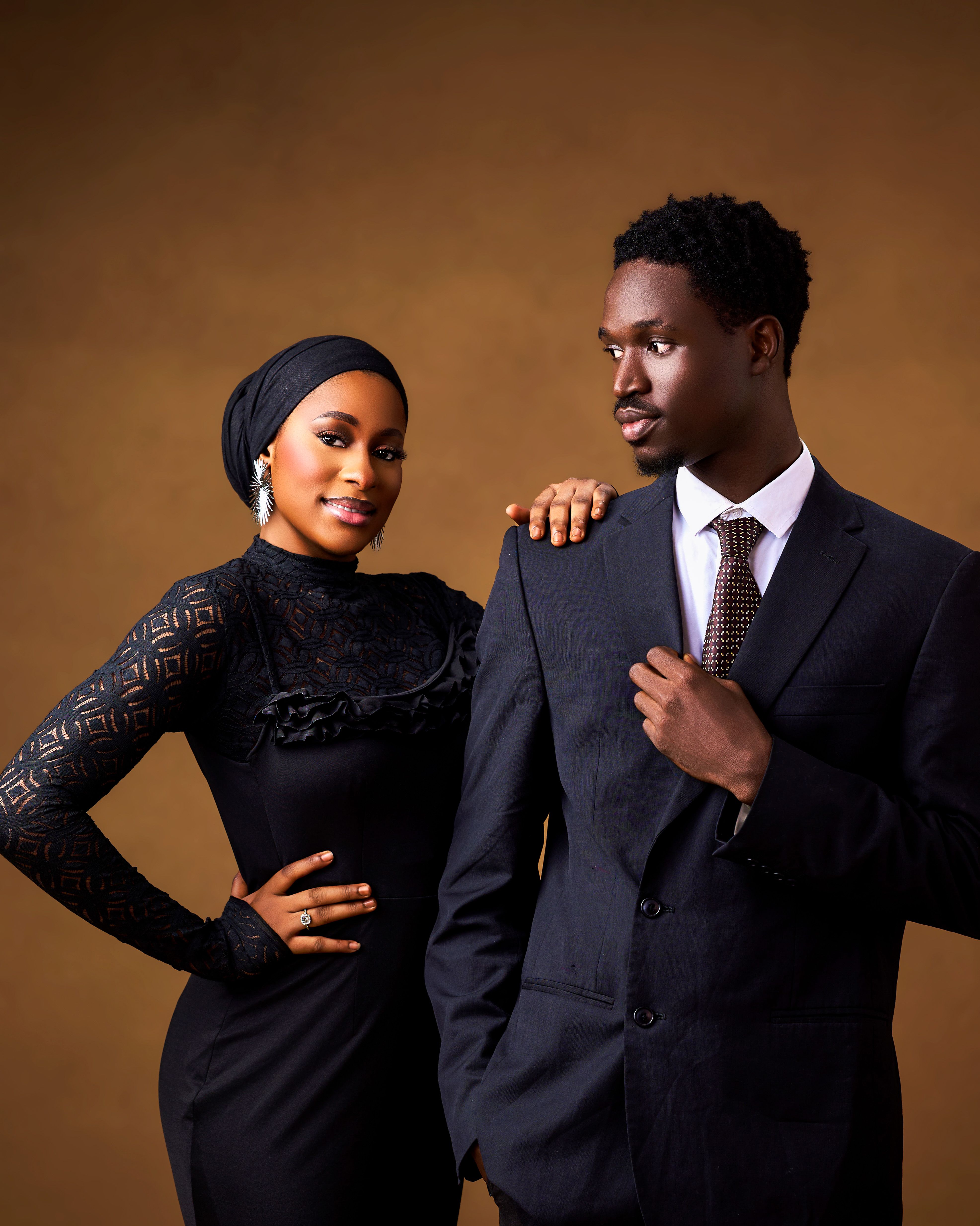 Elegant Couple Posing in Formal Attire  Free Stock Photo