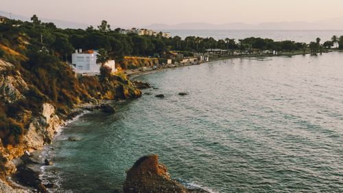 Free Beautiful coastal view with cliffs and calm sea at sunset, offering a tranquil environment. Stock Photo