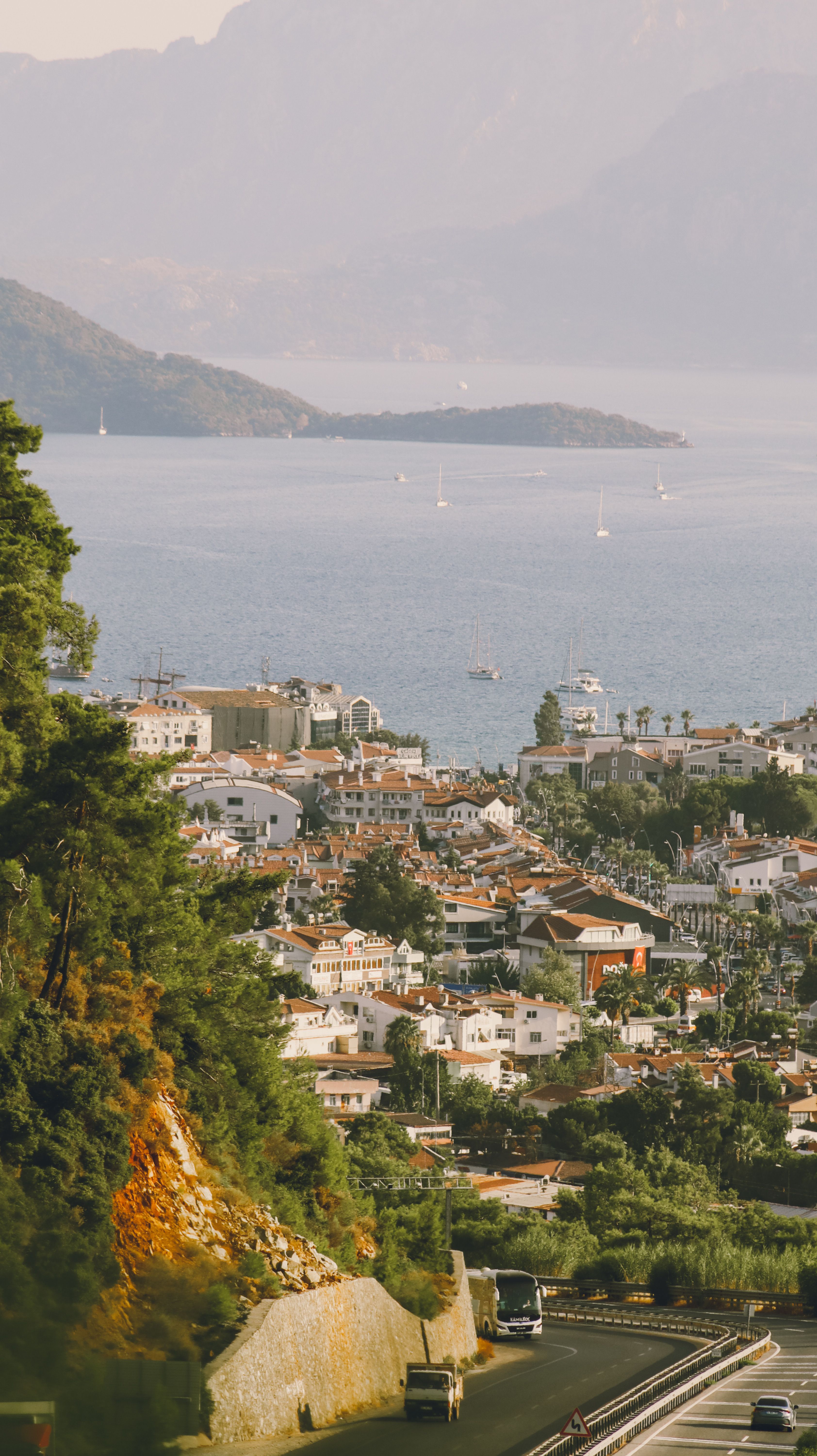 Scenic Coastal Town Overlooking Tranquil Sea · Free Stock Photo