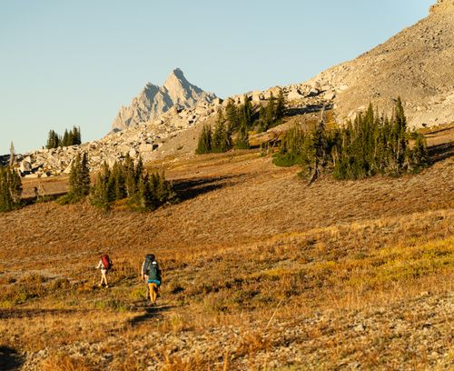 Free Two hikers on the Teton Crest Trail at Grand Teton National Park during fall season. Stock Photo