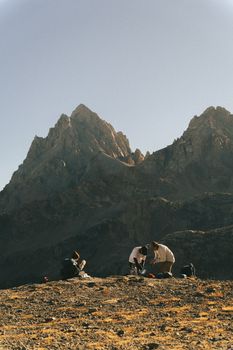 Hikers camping with stunning views of the Grand Teton peaks in Wyoming.