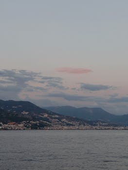 Stunning twilight view of a Turkish coastline with mountains and sea.