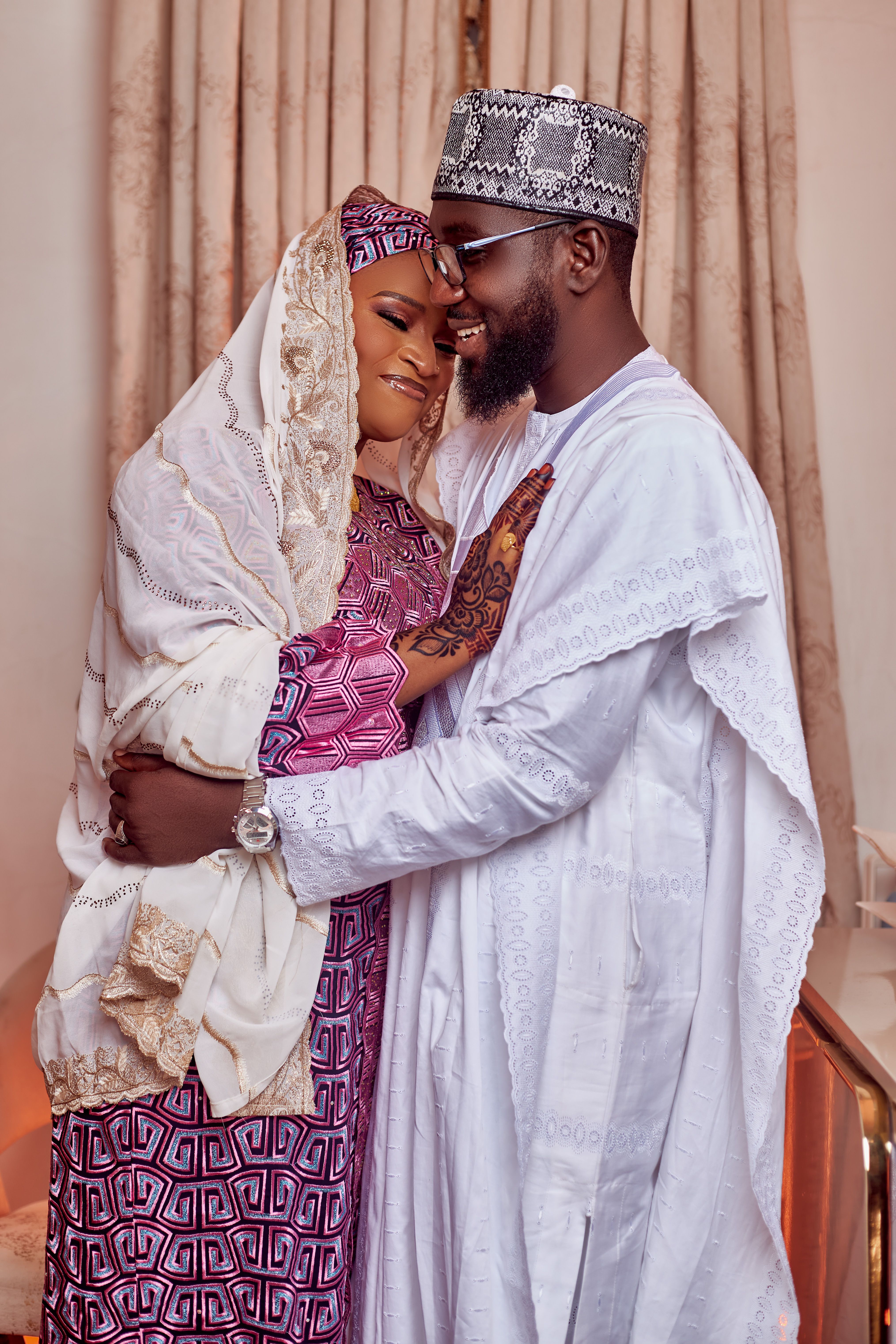 cameroon women dating – couple embracing in traditional attire