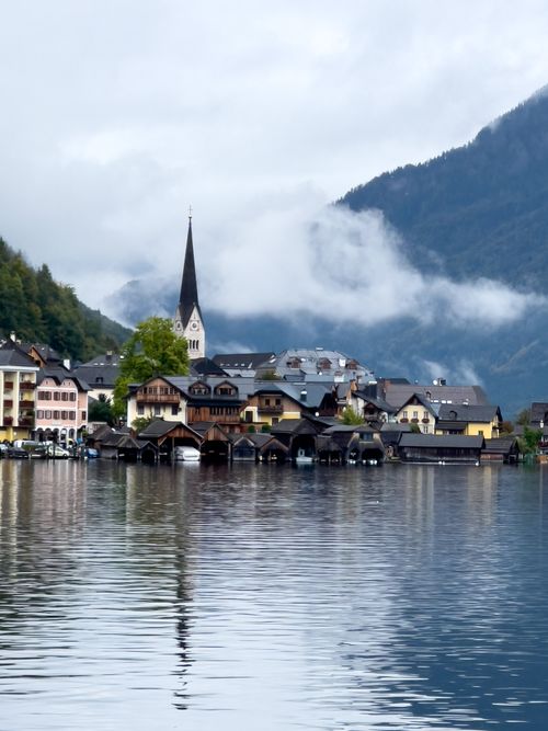 Free Picturesque view of Hallstatt village with lake and mountains in fall. Stock Photo