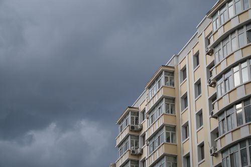 Free Stormy Sky over a Residential Building Stock Photo