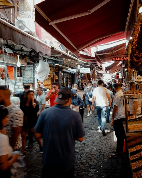 Free Experience the bustling shopping scene at İstanbul's Eminönü Bazaar, capturing daily life. Stock Photo