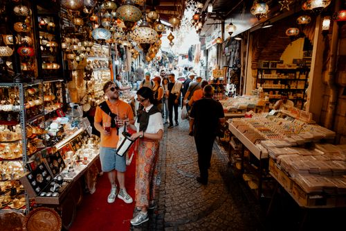 Free A bustling scene in İstanbul's Grand Bazaar with colorful lamps, shoppers, and vibrant market stalls. Stock Photo