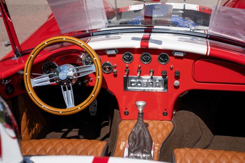Free Detailed view of a classic Cobra car interior showcasing red design and dashboard. Stock Photo