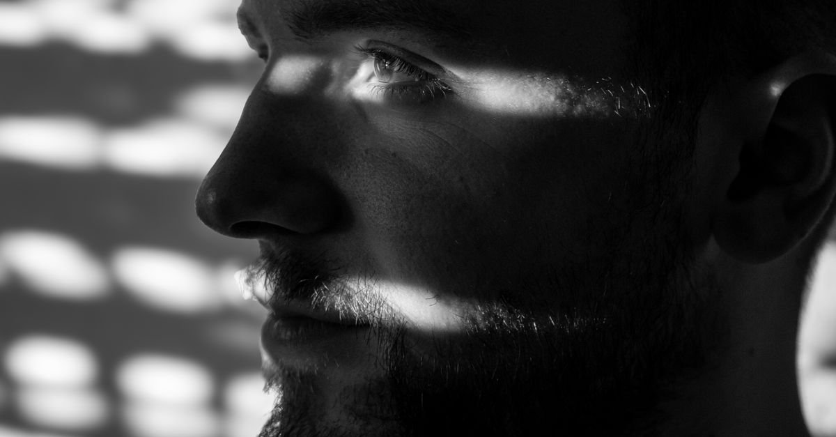 Dramatic Shadows Portrait Contemplative Portrait with Dramatic Shadows · Free Stock Photo