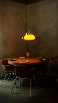 A warm, inviting restaurant table setting with ambient lighting and elegant decor.