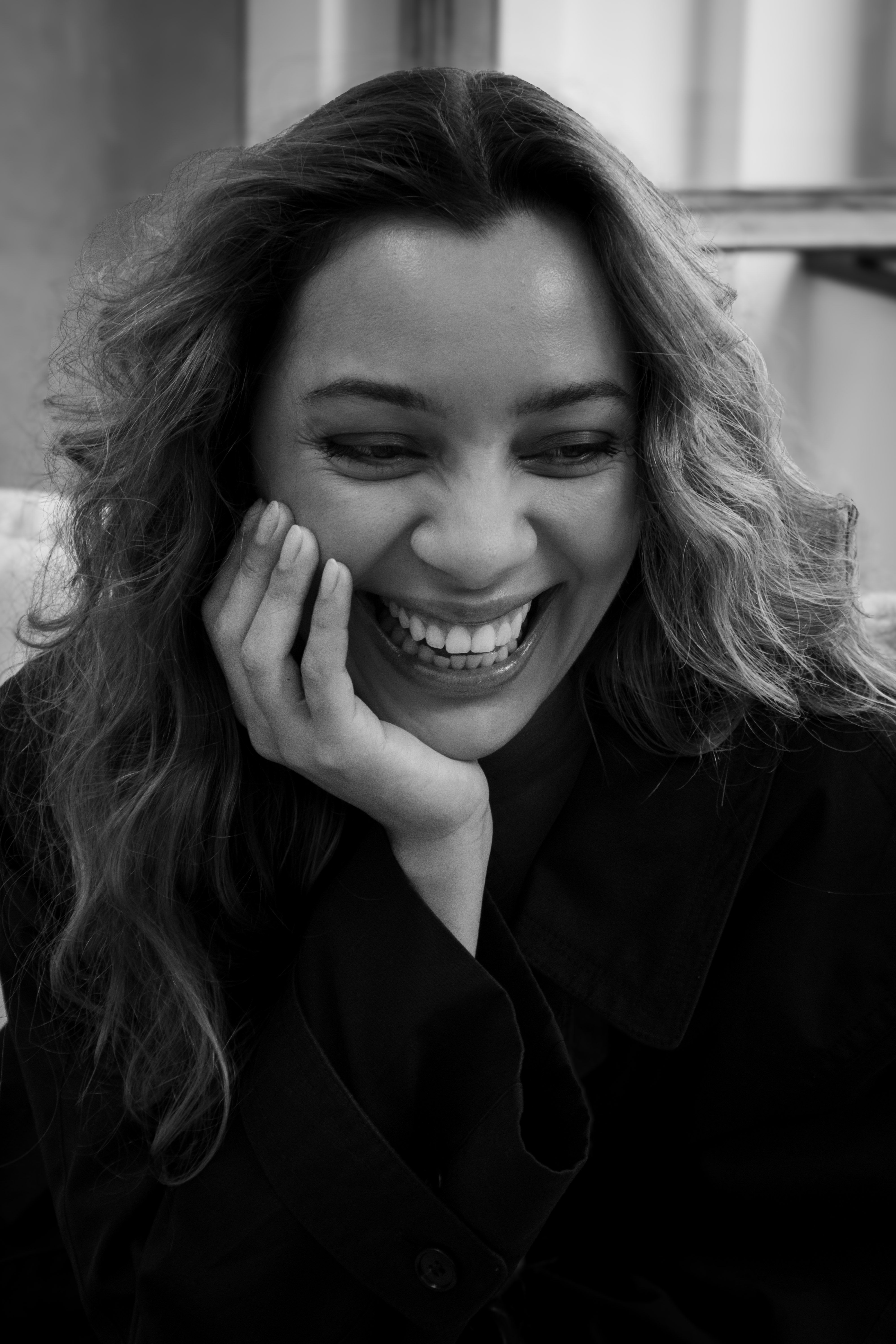 Joyful Black and White Portrait of Smiling Woman · Free Stock Photo