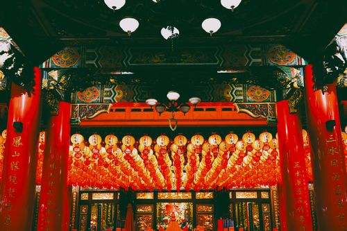 Free Vibrant interior of a Taiwanese temple adorned with red lanterns and intricate decorations. Stock Photo