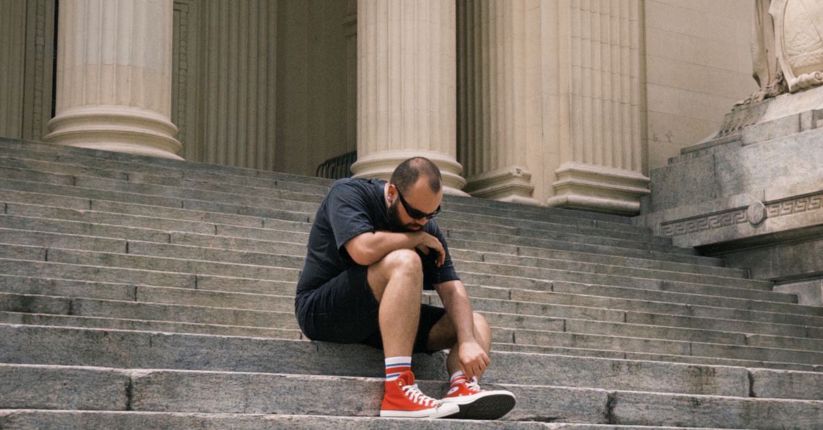 Contemplation Steps Contemplative Moment on Urban Stone Steps · Free Stock Photo