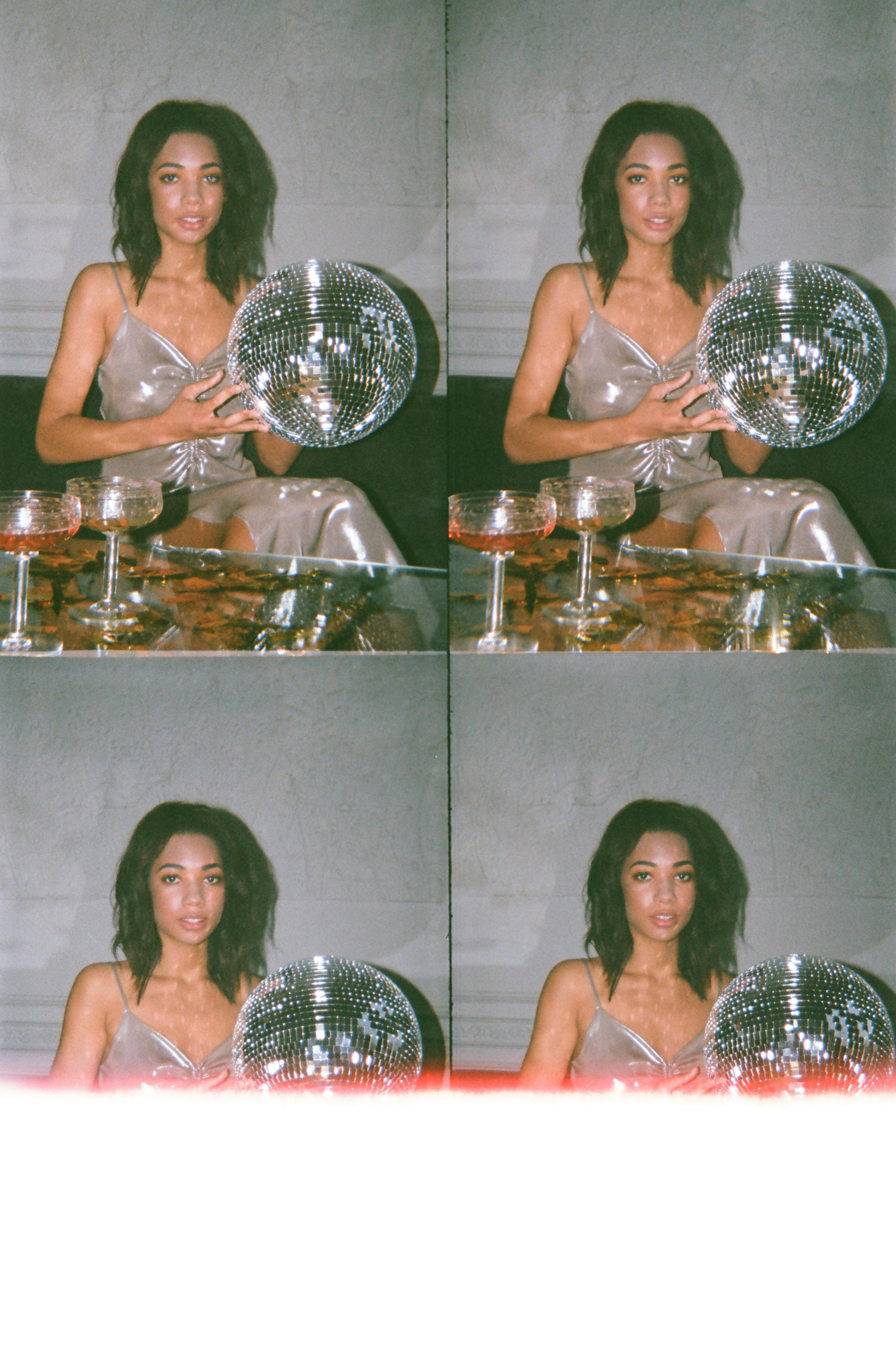 photo of woman holding disco ball