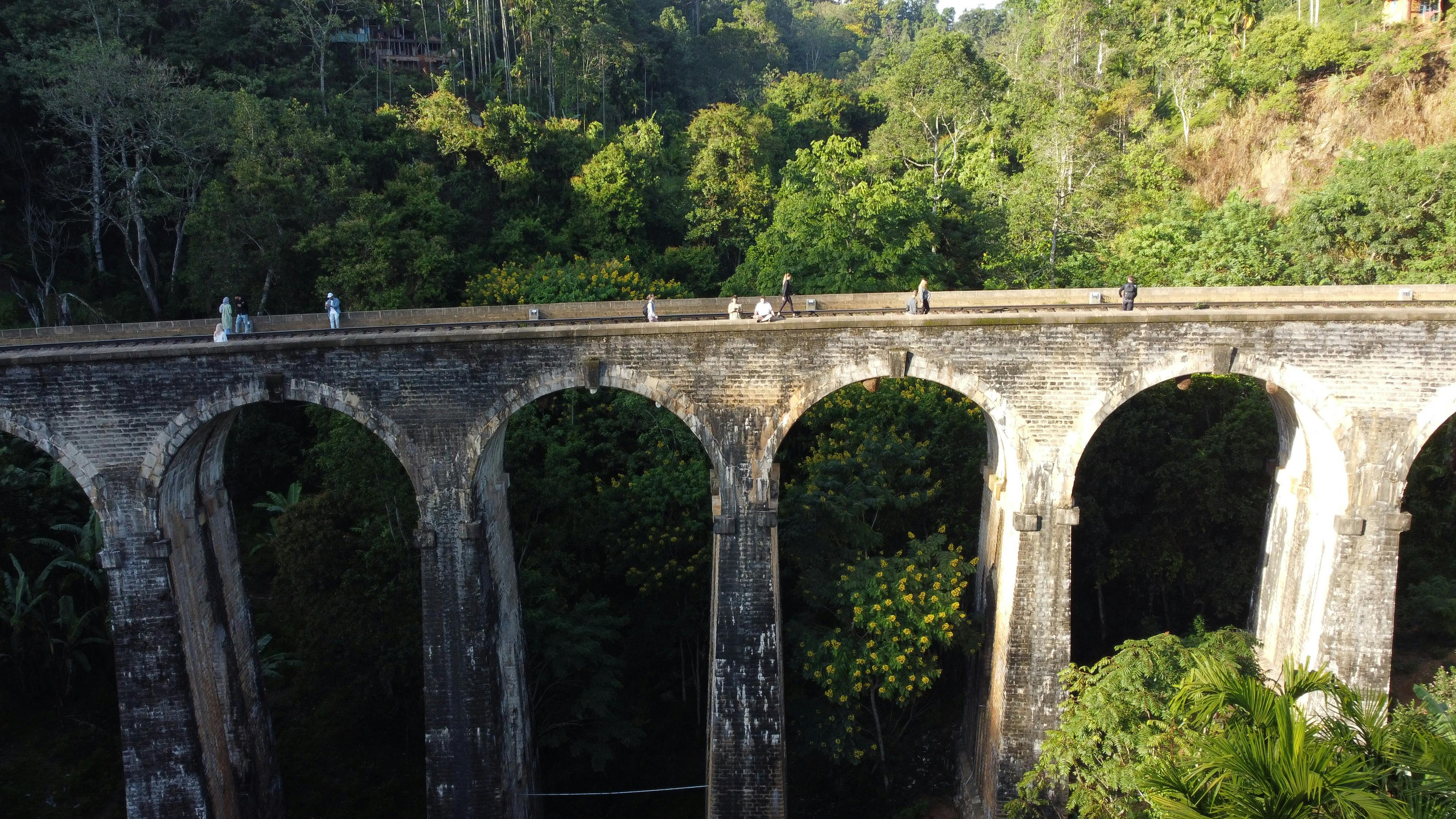 Aerial view of the iconic Nine Arches Bridge in lush green Ella, Sri Lanka.