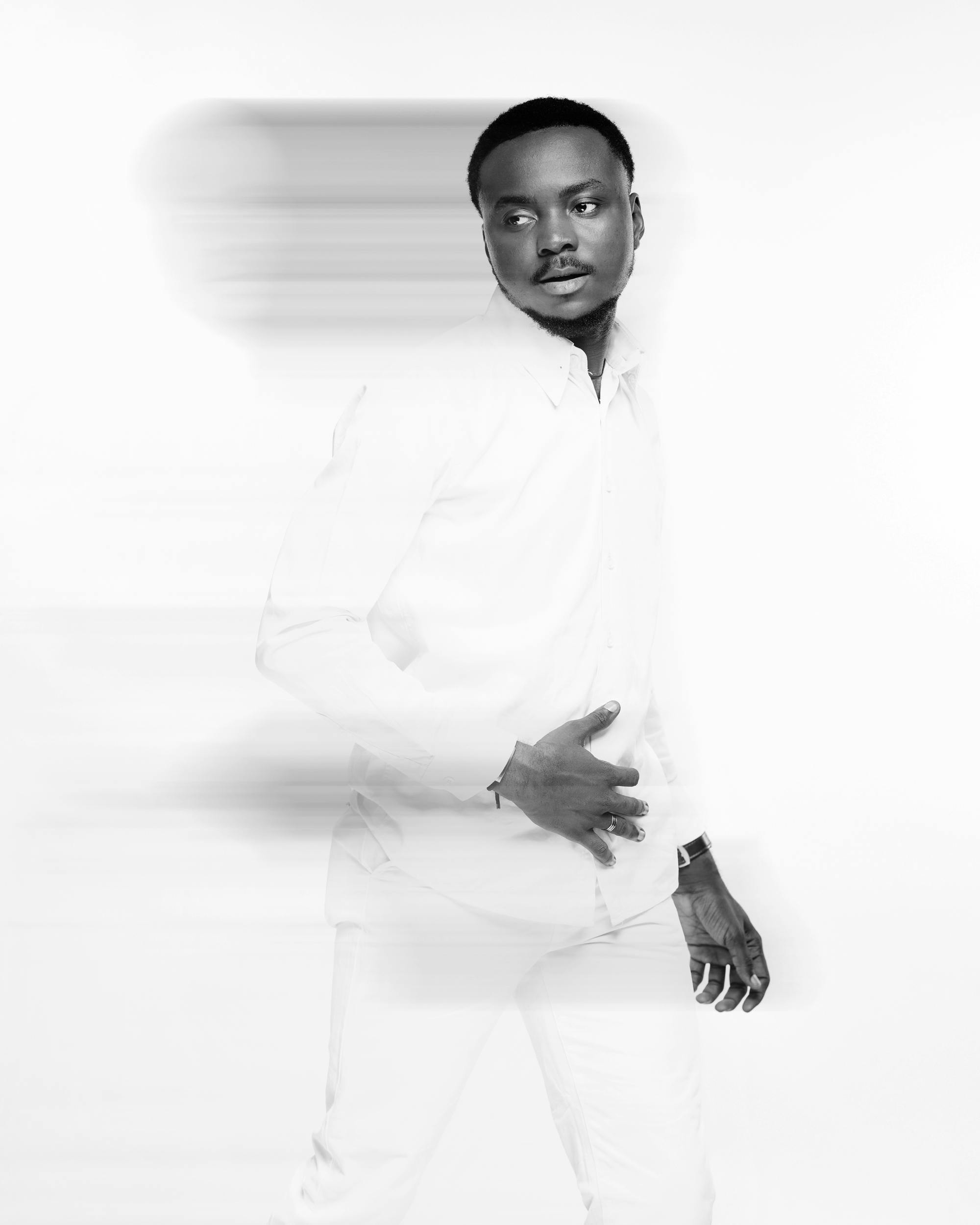 Black and white portrait of a man in motion, artistic blur effect.