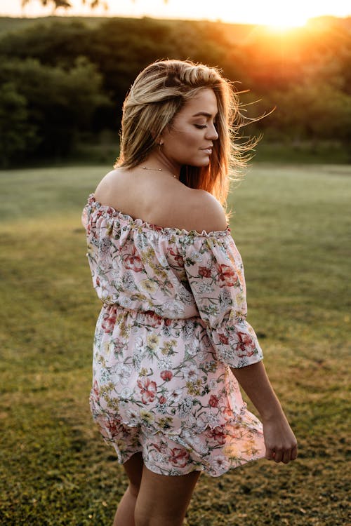 Woman Wearing Pink and White Floral Off-shoulder Mini Dress