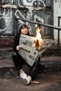 Woman Holding Newspaper While Burning